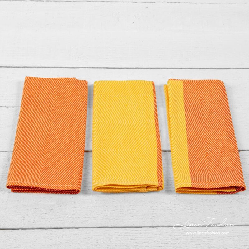Set of kitchen towels colored in orange.