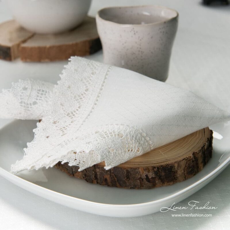 White colored linen napkin with hole pattern.