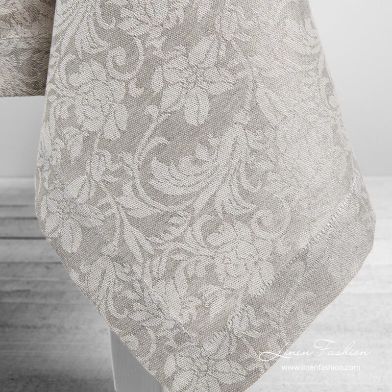 Grey linen tablecloth with flower ornaments, folded border