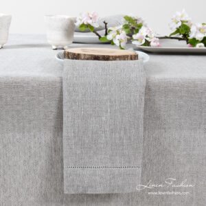 Light grey 100% linen napkin in a slight open-weave pattern, and with a row of hemstitch along all edges