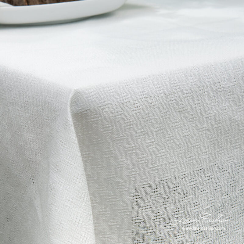 White linen cotton tablecloth with open weave pattern