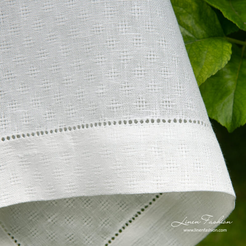 4cm border with hemstitch on white patterned linen tablecloth