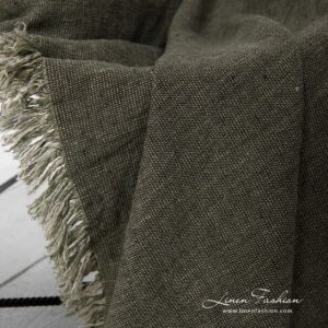 Green linen blanket with loose fringes