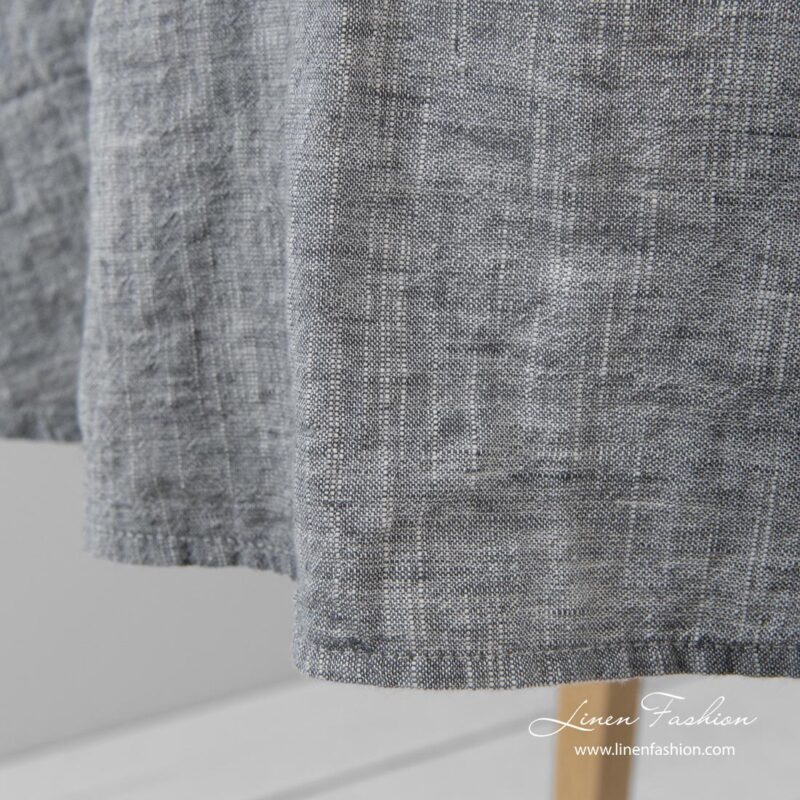 Simple hemmed round tablecloth in dark grey and white melange colors