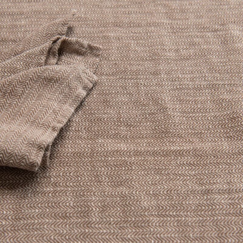 brown linen herringbone tablecloth together with napkins.