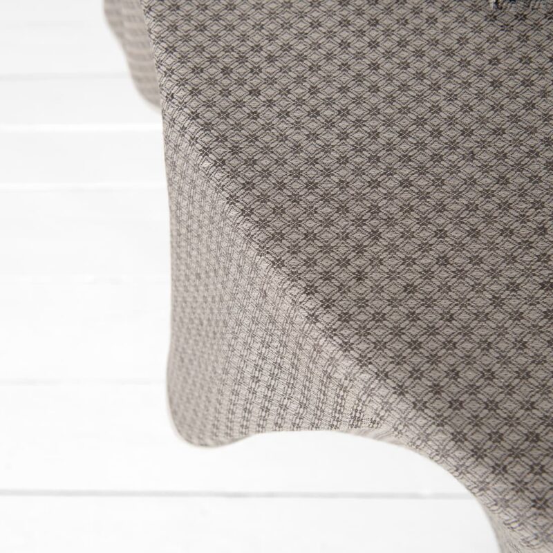 dark brown patterned linen-cotton tablecloth, close top view
