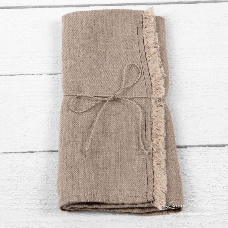 Linen kitchen towel with fringes and brown stitches