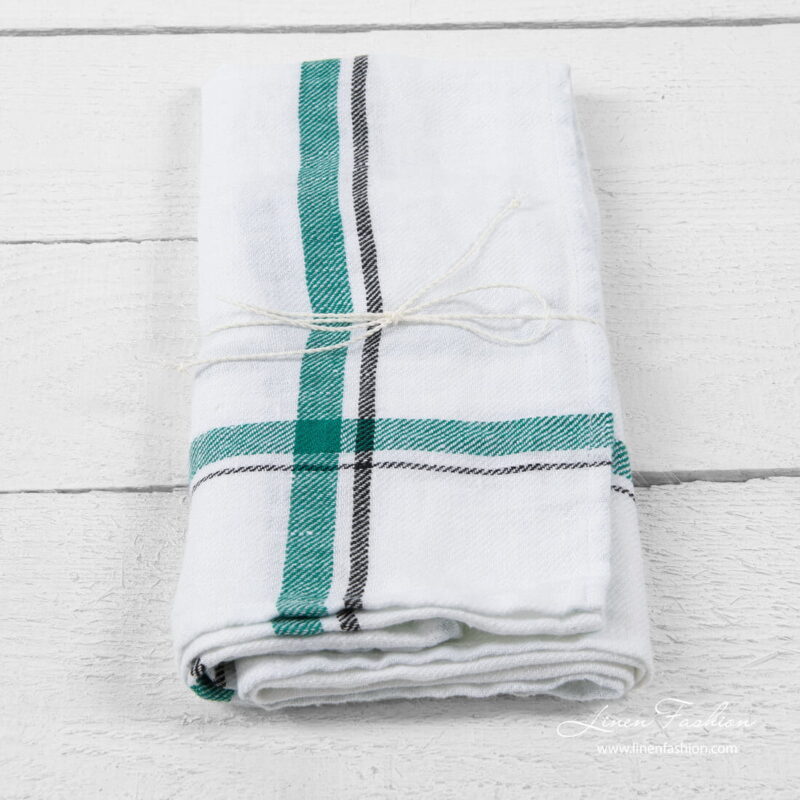 White linen kitchen towel with green/black checks
