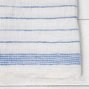 White kitchen towel with blue stripes, waffle weave
