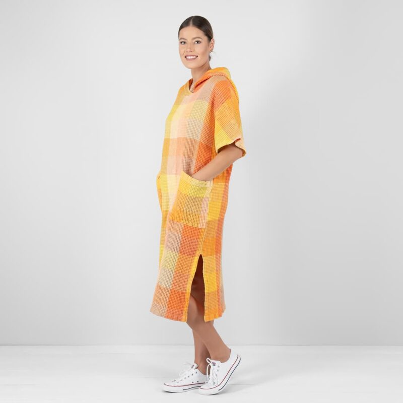 orange linen poncho with slits.
