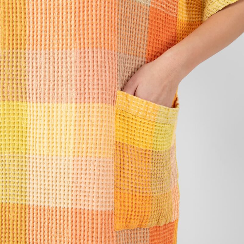 orange linen poncho with pockets.