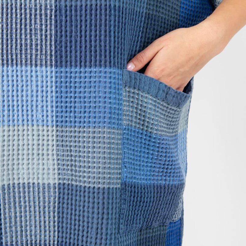 blue linen poncho with pockets.