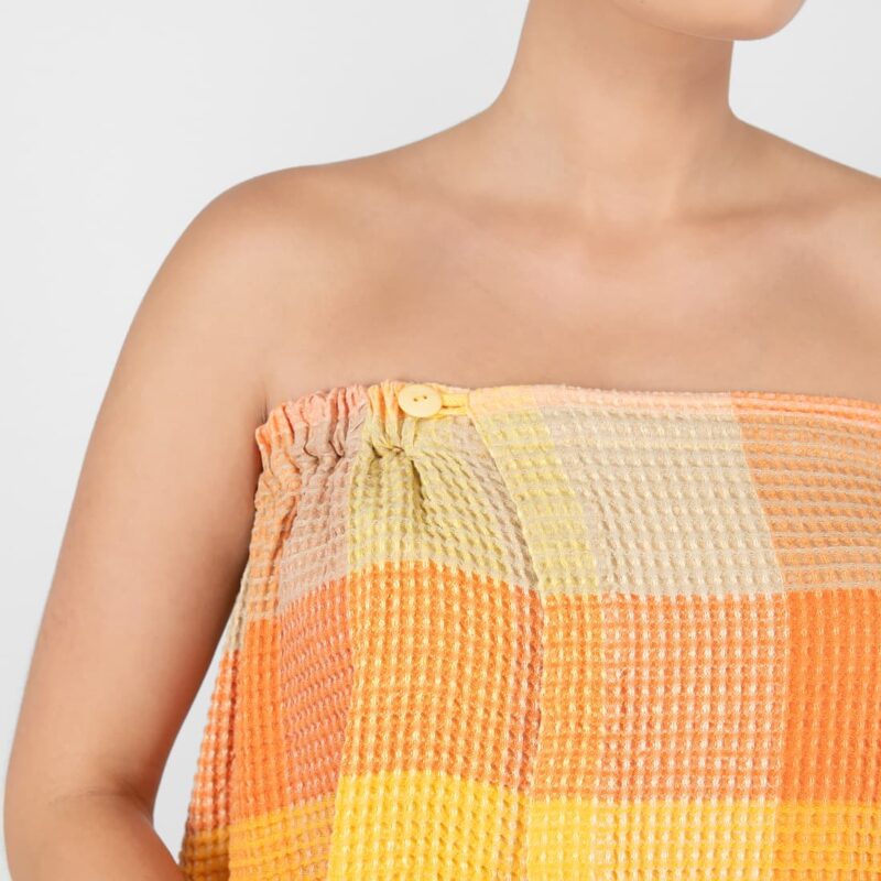 orange linen wrap towel, with button closure.