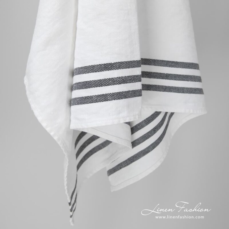 Bright white towel with three black stripes