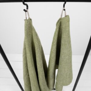 linen green waffle towel with hanger.