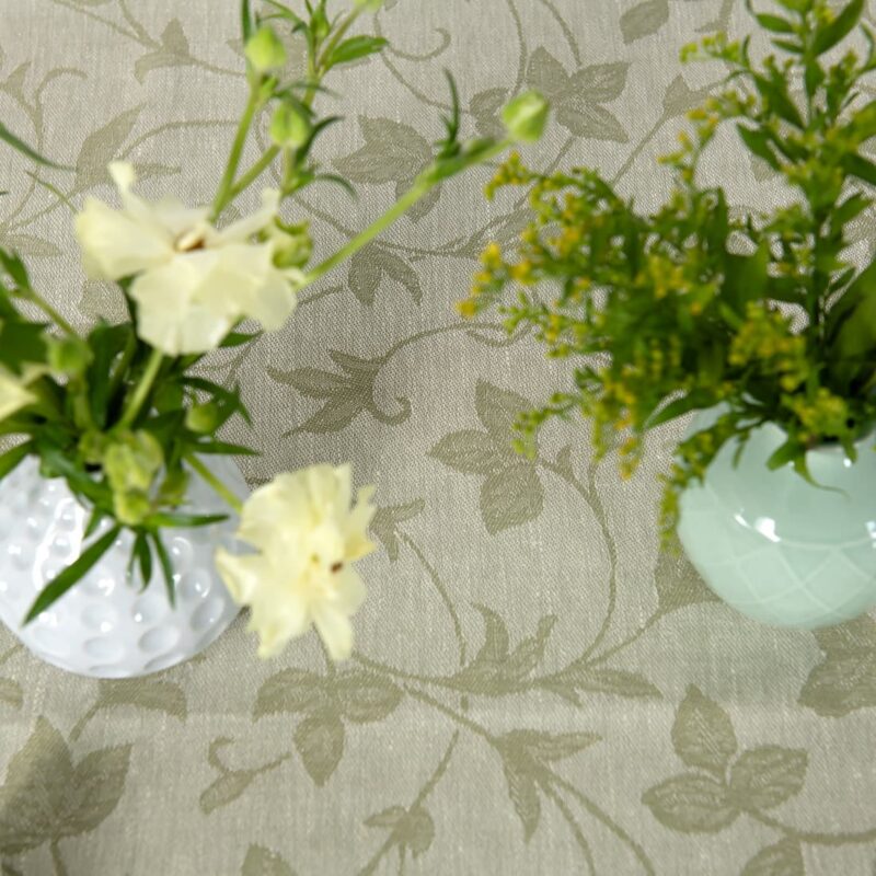 Linen cotton green floral vine pattern tablecloth, with flower vases