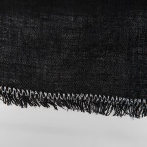 linen black tablecloth with decorative seam & loose fringes.
