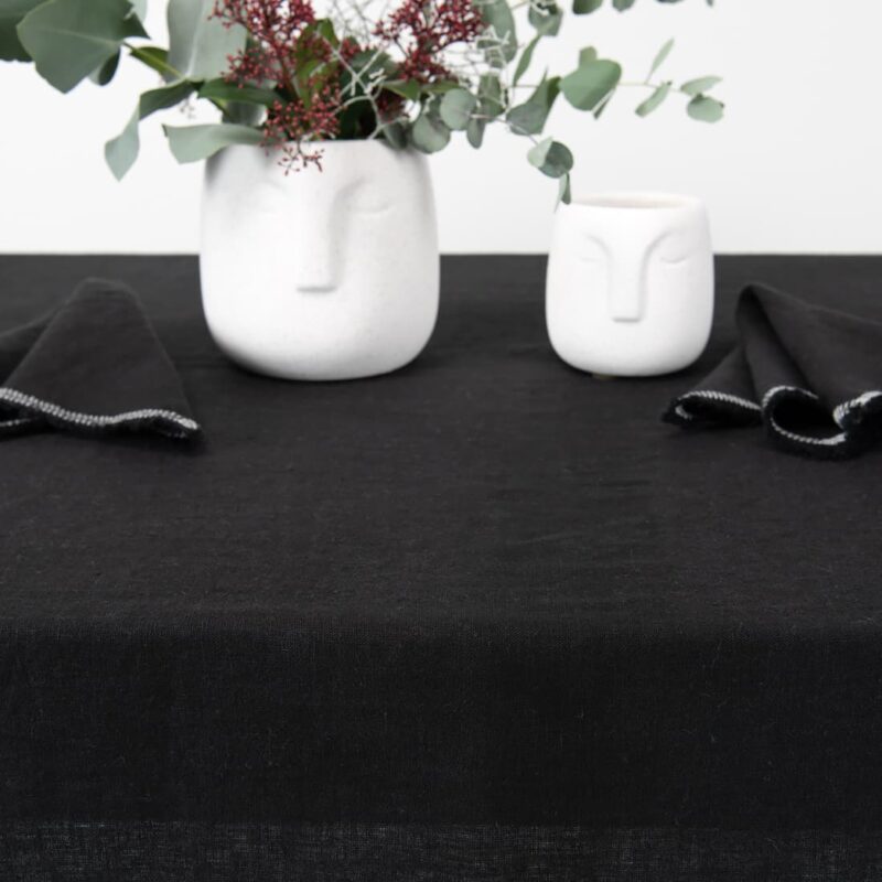 linen black tablecloth with decorative seam, for decoration.