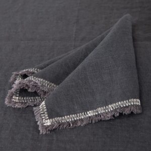 grey linen napkin with decorative stitch, with 1.5cm. loose fringes.
