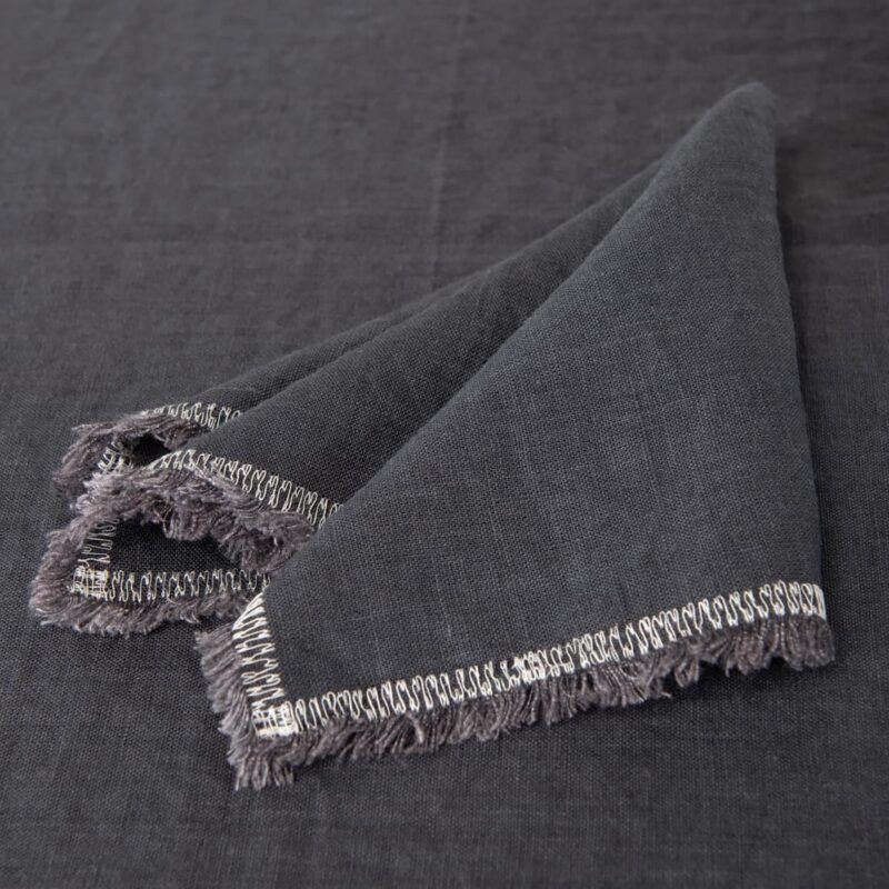 grey linen napkin with decorative stitch, with 1.5cm. loose fringes.
