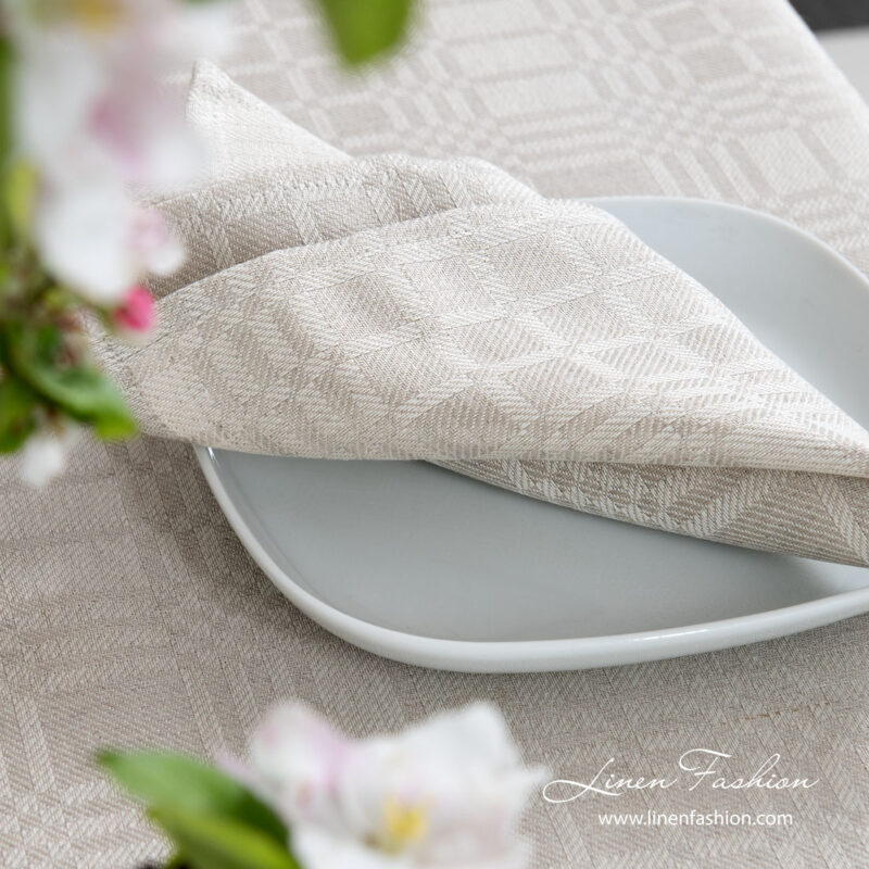 Playfully patterned napkin made from medium weight grey and white linen / cotton fabric
