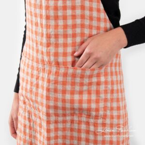 Linen apron in orange color, gamma.