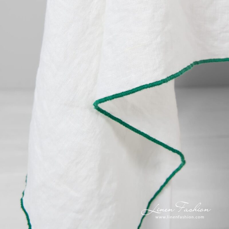 Off-white linen tablecloth with bright green babylock stitch