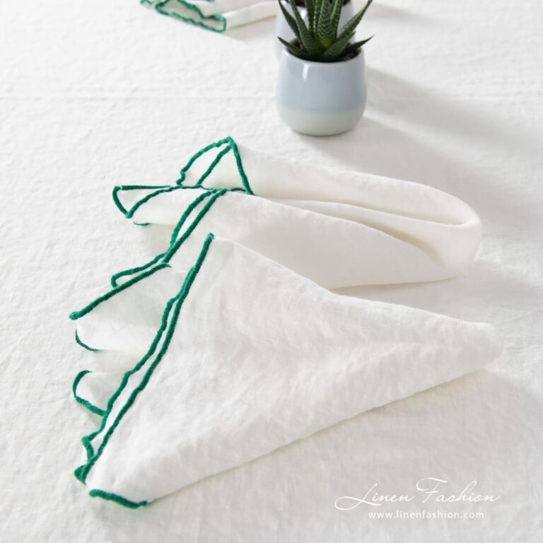 ARVO white linen napkin with bright green border