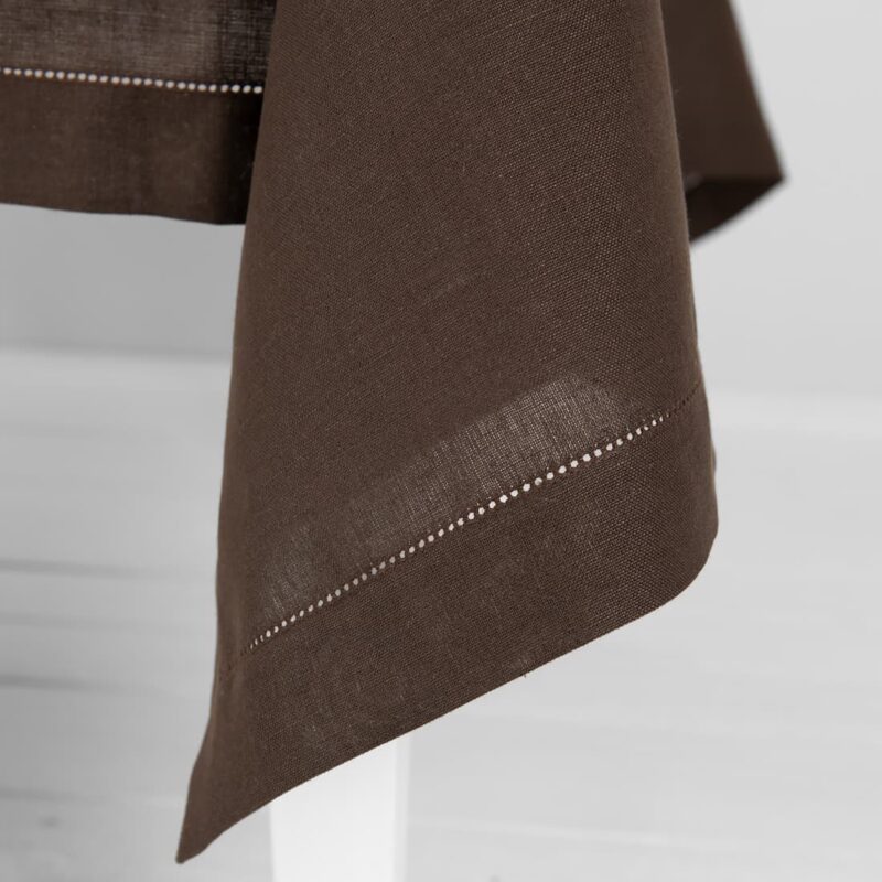 brown linen tablecloth, decorated with hemstitch.