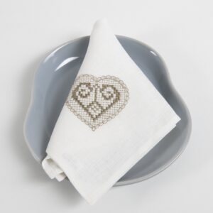 White linen napkin with beige embroidery