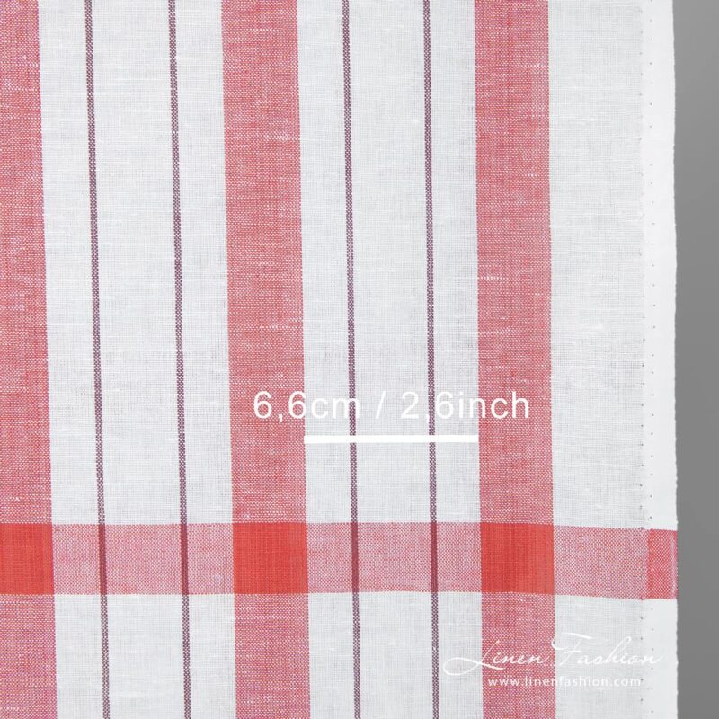 Narrow white linen cotton fabric with red stripes detail close up view