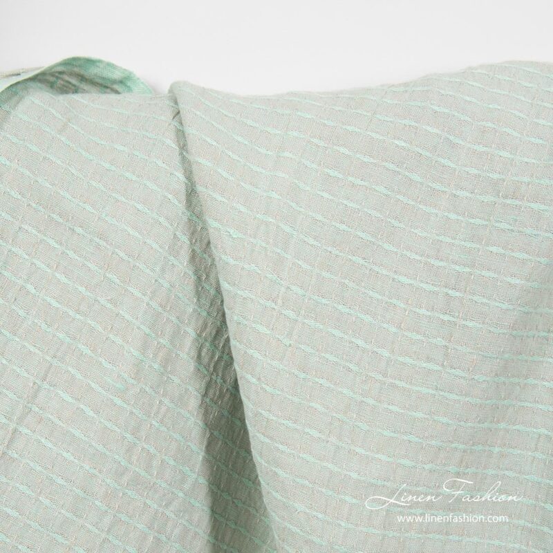 Greenish patterned linen fabric, washed