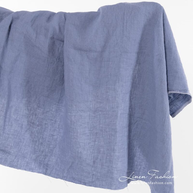 Dusty blue linen fabric, washed.