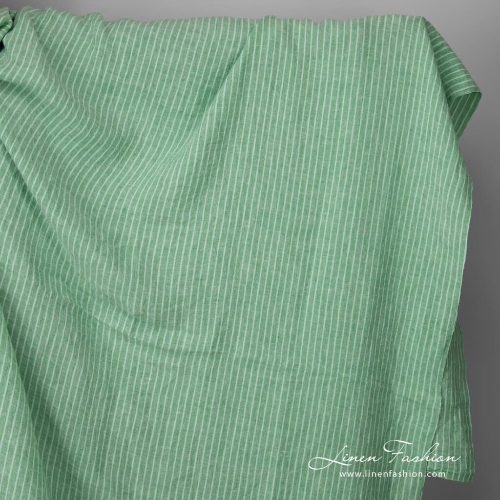 Wide washed green striped linen fabric