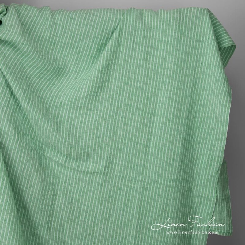 Wide washed green striped linen fabric
