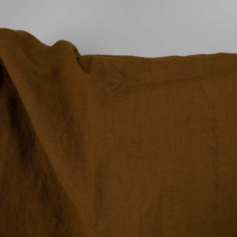 Washed linen fabric in golden brown, plain weave