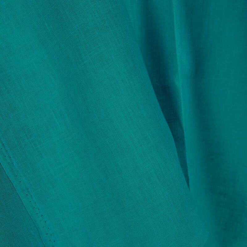 Linen fabric in tile blue colour close up detail