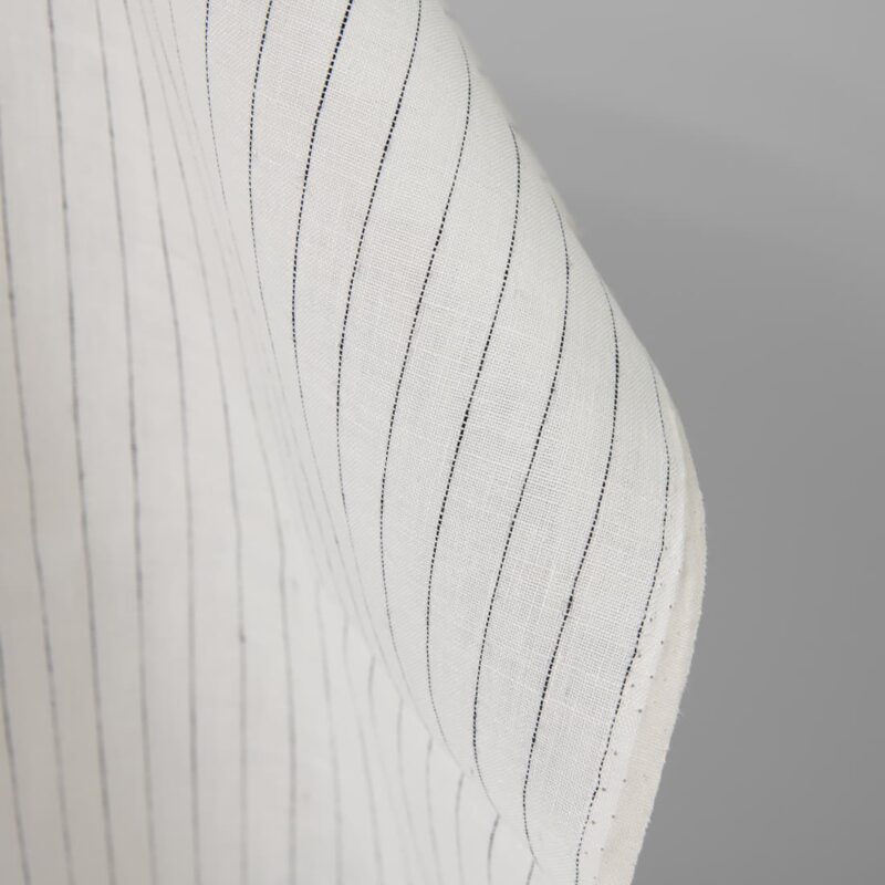 Linen fabric off-white colour with black stripes close up detail pinstripes