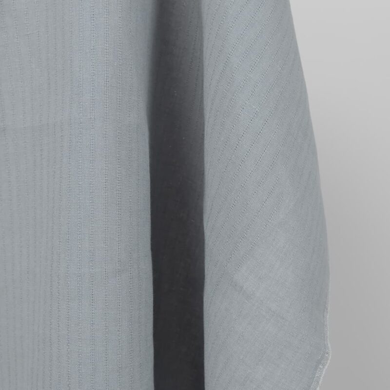 blue grey fabric with open stripes vertically.