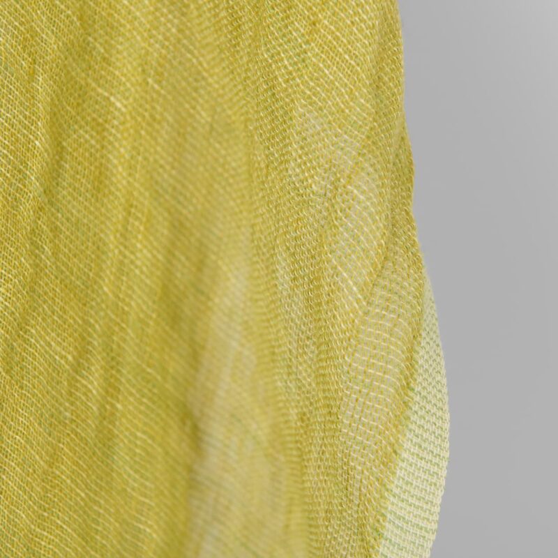 Washed linen fabric yellow green transparent, fabric edge