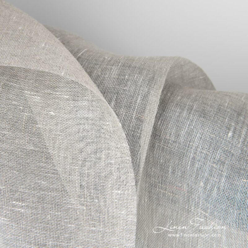 Transparent linen fabric in light grey can be used to make curtains, shawls and other sheer and lightweight textile.