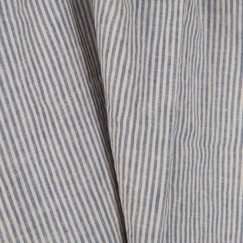 Washed linen fabric with brownish and blueish grey stripes close up view