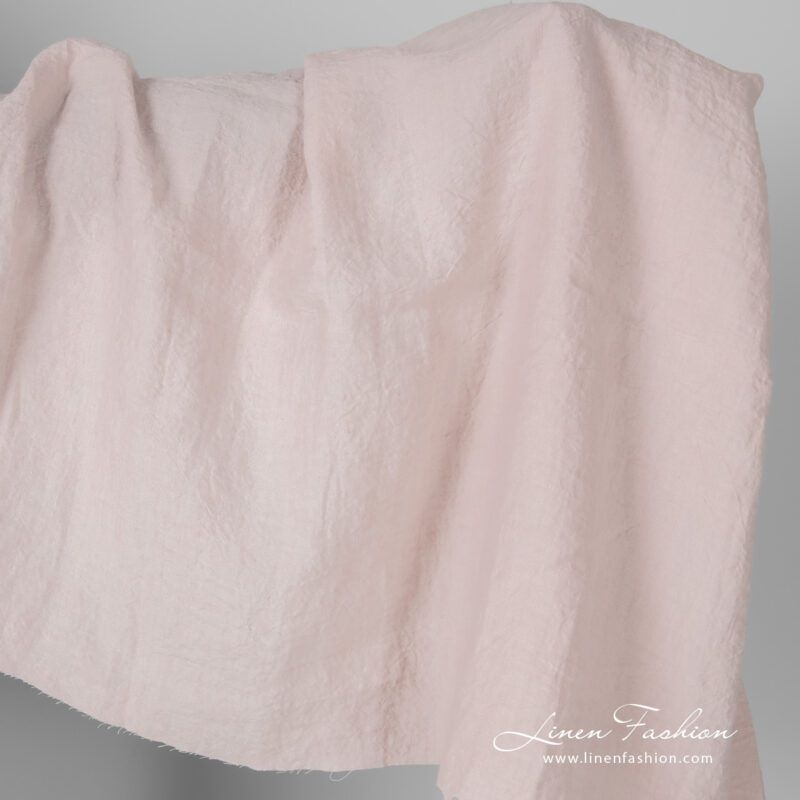 Wide width linen fabric in light pink colour, washed