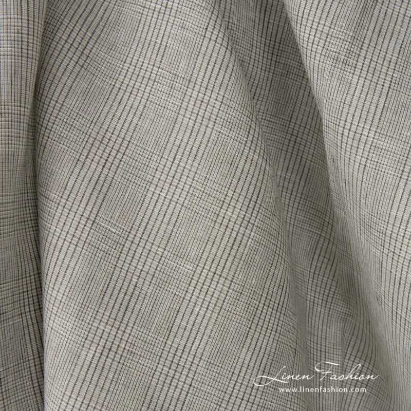 Linen fabric light beige with green checks close up detail