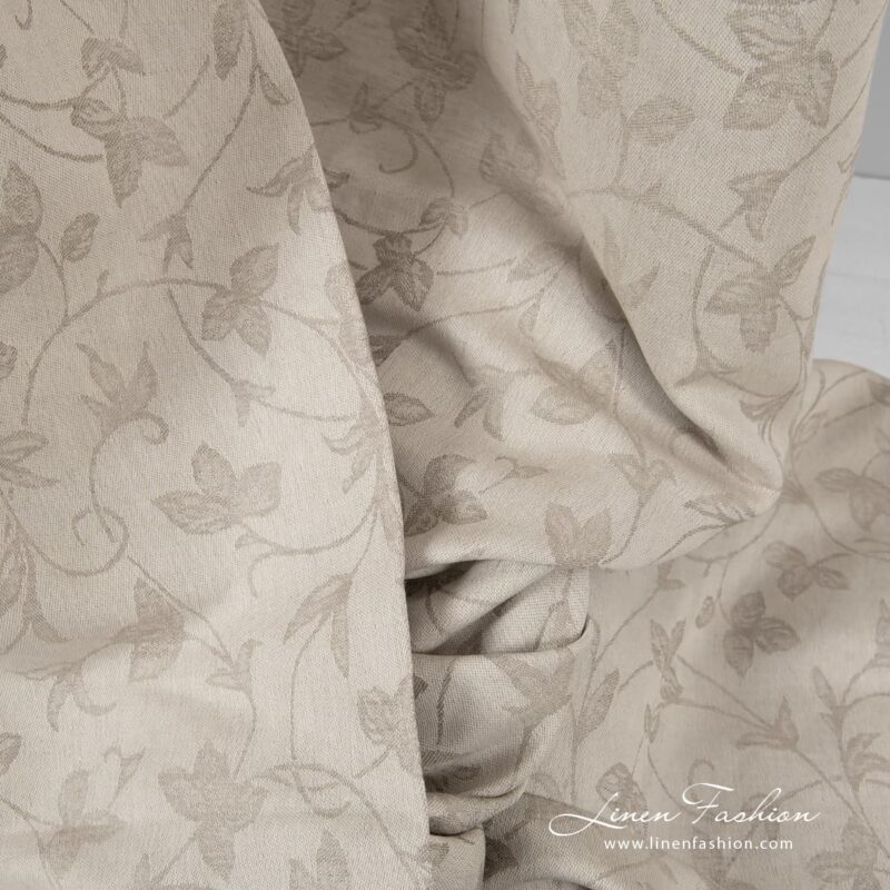 Jacquard linen cotton fabric wovenfrom beige and white yarns