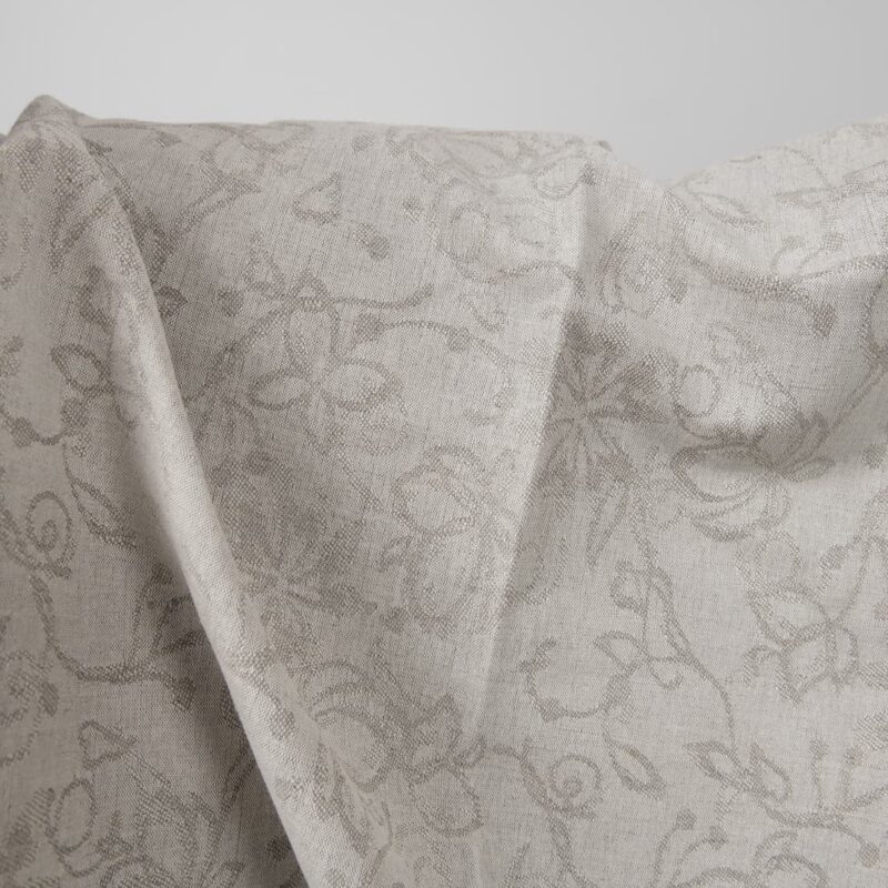 Natural colour linen cotton jacquard fabric with flowers close up detail