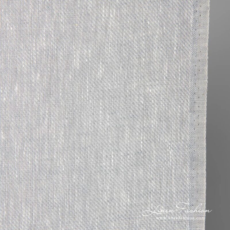 Narrow linen fabric in white-grey melange close up photo