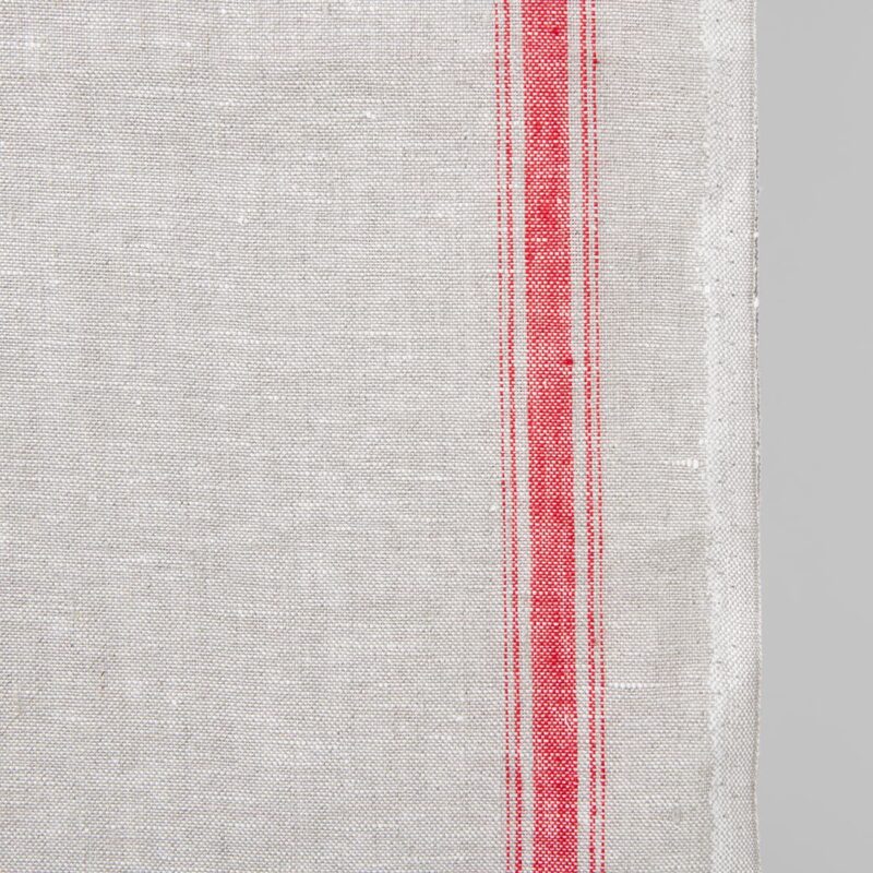 Narrow linen fabric light grey colour with red stripes close up edge