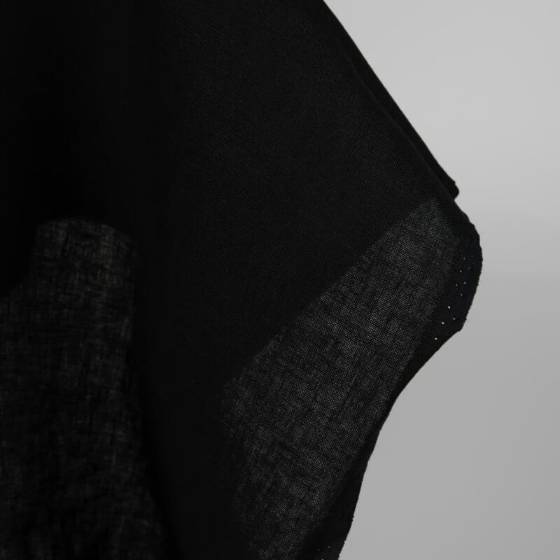 Heavy linen fabric black colour close up edge view