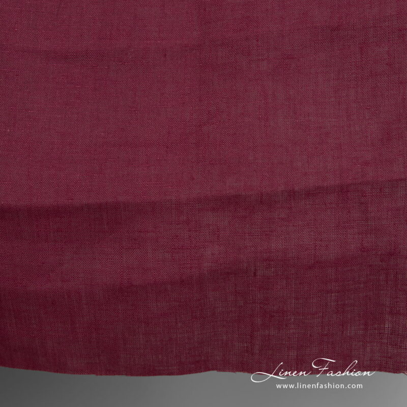 Linen fabric deep cherry colour close up detail